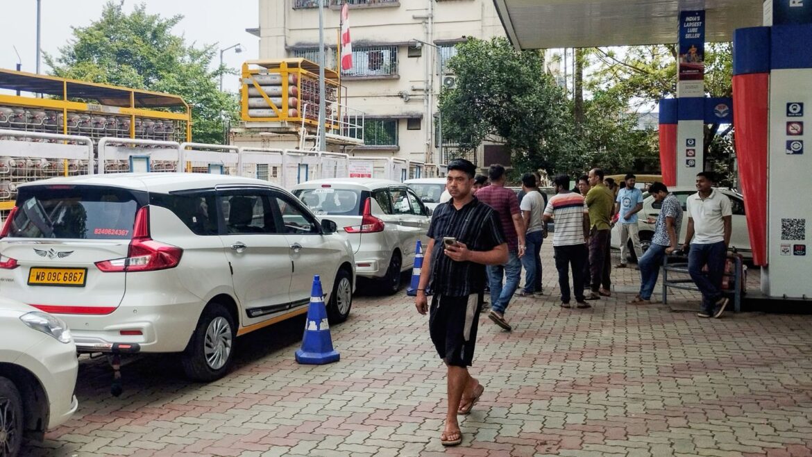 Long queue of cars and auto-rickshaws at a petrol pump as people wait to refill fuel, in Kolkata on Wednesday.