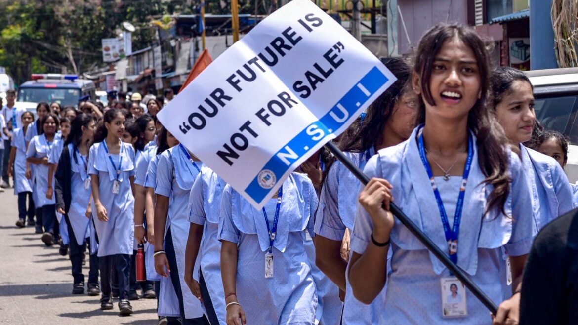 School students join an NSUI protest rally against the alleged NEET scam and the Union government, in Chikkamagaluru, Karnataka, Monday, May 25, 2026. (PTI Photo)